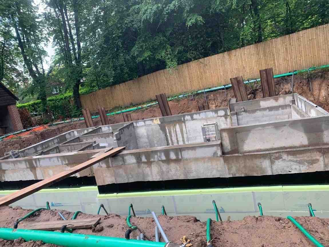 Concrete strip foundations poured and prepared for a new extension in Manchester