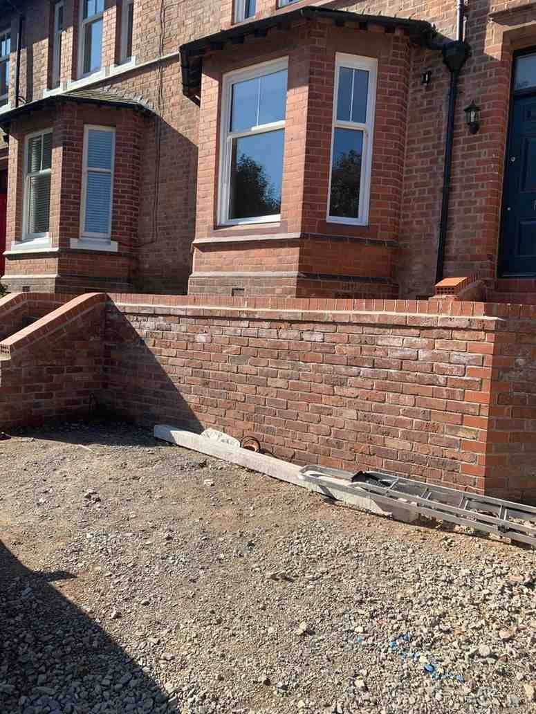Red brick garden wall built by AJ Brickwork in Manchester