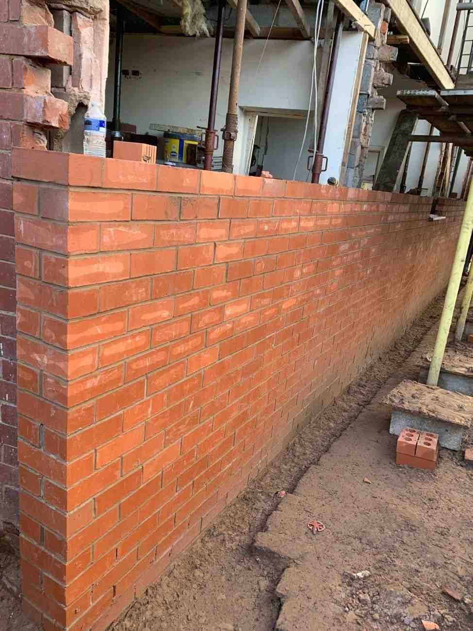 Newly built red brick wall by AJ Brickwork in Manchester
